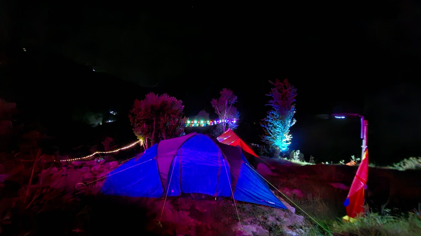 Small camp tents with sleeping bags at night